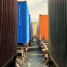 a-port-worker-inspecting-shipping-container-trains-2023-11-27-05-30-56-utc